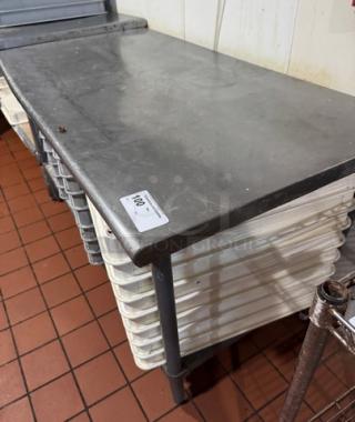 Eagle work table with under shelf. Stainless steel, sturdy, used condition. Features label marked "100."