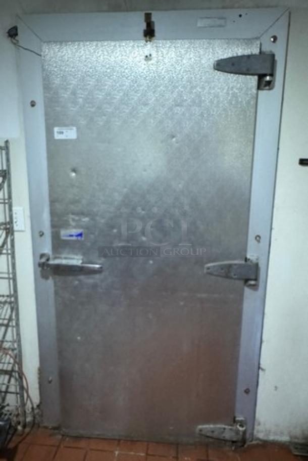 Commercial cooler door, steel finish, 37"x79.5", sturdy hinges, minor surface wear, suitable for industrial use.