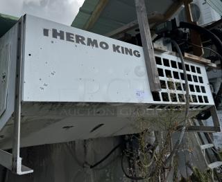 Thermo King box freezer, white, tested and working. Worn exterior with visible branding. Auction label "112" attached.