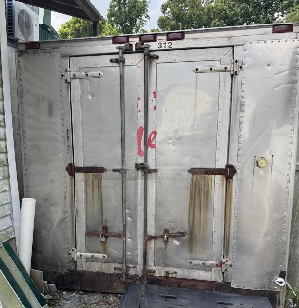 Thermo King box freezer, tested and working, features double doors, visible wear and rust stains, marked "312".