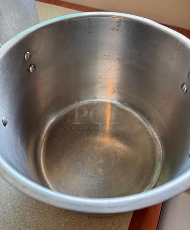 28 Qt. Chef's stock pot with lid, stainless steel, well-used condition, visible interior wear, riveted handles.