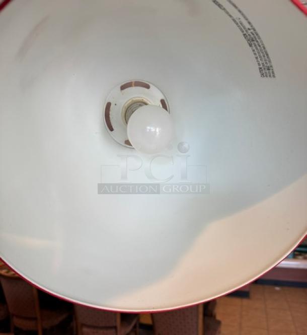Red pendant light interior, featuring a white bulb socket and visible product details. Auction includes 15 lights, varying sizes.