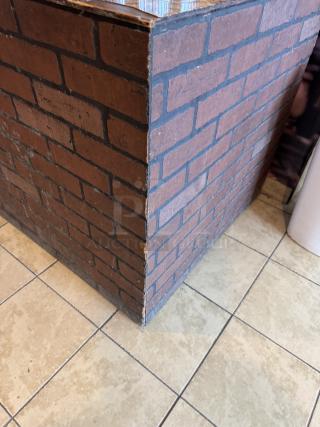 10 ft wooden cabinet with rustic brick-pattern finish, featuring a built-in salad bar insert. Dinnerware not included.