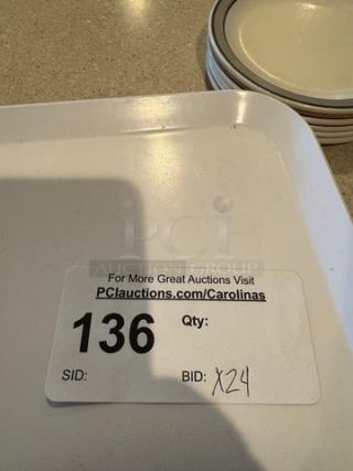 Set of 24 square ceramic plates. Light color, smooth surface. Auction label showing lot number 136, bid number X24.