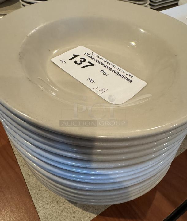 White ceramic pasta bowls, 14 pieces, stacked, with auction label indicating lot 137. Minimal signs of wear.