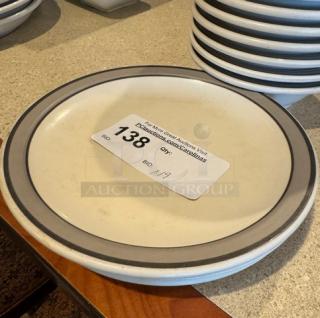 Set of decorative ceramic plates and bowls, light gray rim, excellent condition, auction label with lot number 138.