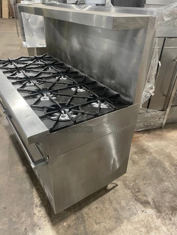 Garland H284 stainless steel 10-burner range and double oven combo with backsplash and salamander shelf. Natural gas.