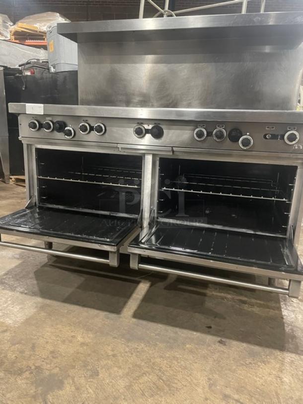 Garland H284 stainless steel 10-burner range with double oven, back splash, overhead salamander shelf, wired oven rack, on legs.