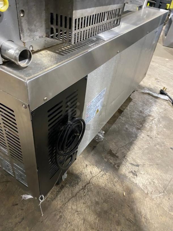 Universal Coolers stainless steel two-drawer refrigerated chef base, model CBI-52, on casters. Serial: 6809260222022806.