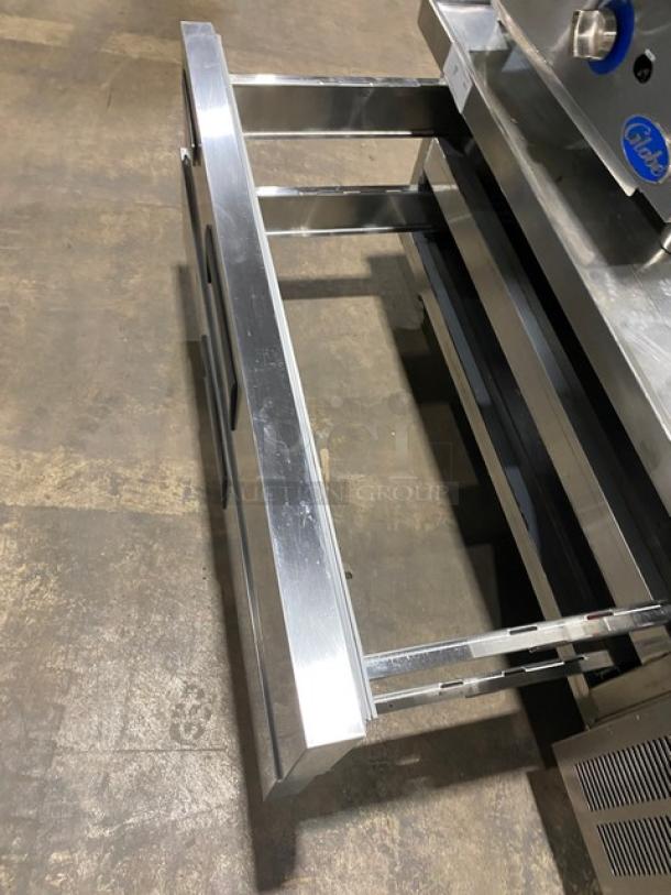 Universal Coolers CBI52 stainless steel two drawer refrigerated chef base, model CBI-52, on casters, shown open.