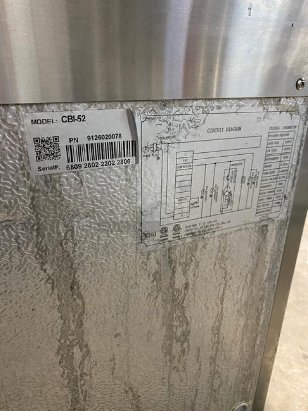Universal Coolers CBI52 stainless steel two-drawer refrigerated chef base, model CBI-52, serial 6809260222022806, on casters.