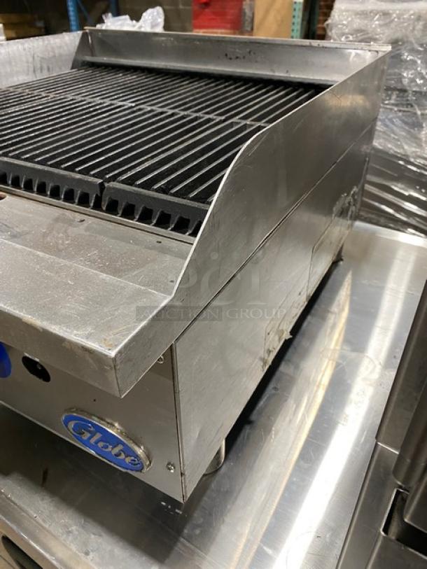 Globe stainless steel natural gas countertop char broiler on legs, in good condition. Serial number: 1715042736.