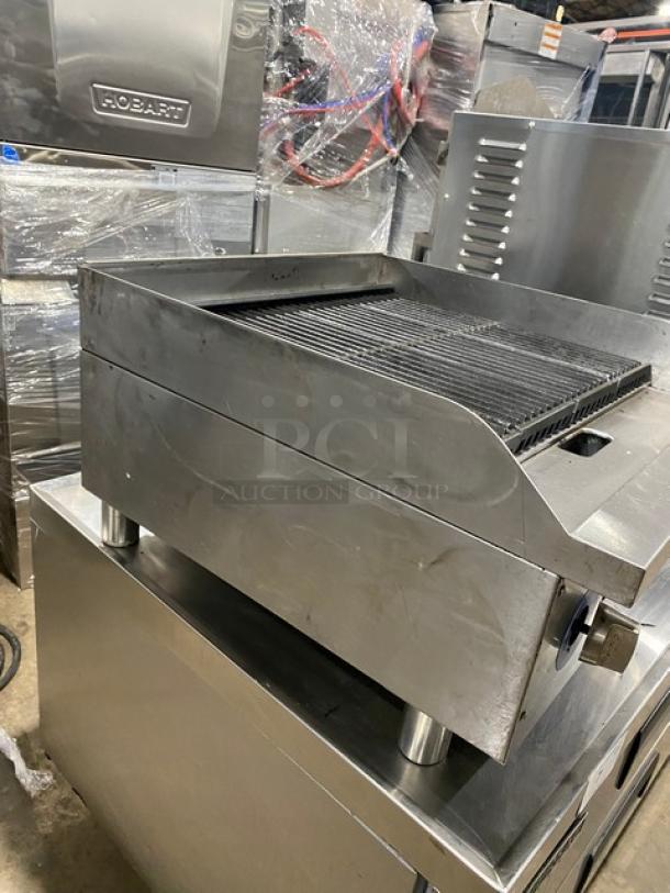 Globe stainless steel countertop char broiler, natural gas powered, on legs, SN: 1715042736, used condition.
