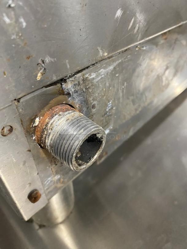 Globe stainless steel natural gas countertop char broiler, SN: 1715042736. Shown with visible rust and wear.