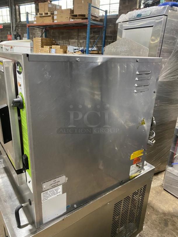 LoLo commercial stainless steel single compartment countertop steamer with built-in pan holding rack, natural gas powered.