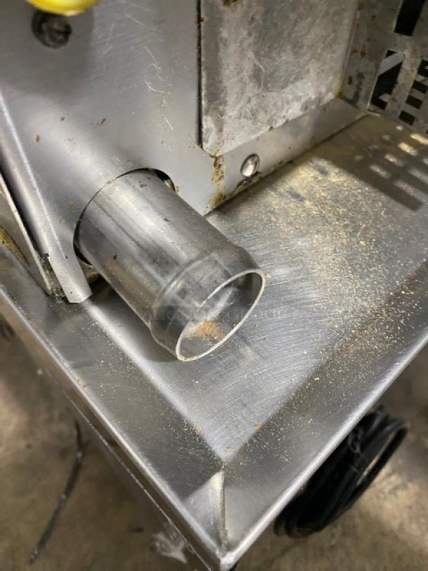 LoLo commercial stainless steel natural gas steamer with built-in pan rack. Visible surface wear, sturdy construction.