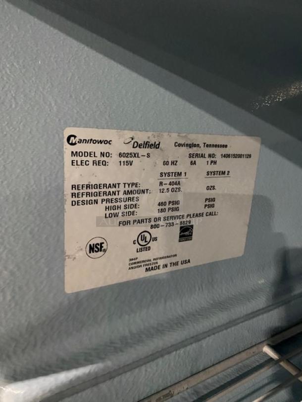 Delfield 6025XL-S commercial refrigerator label displaying model, serial number, and specs. Made in USA, Energy Star certified.