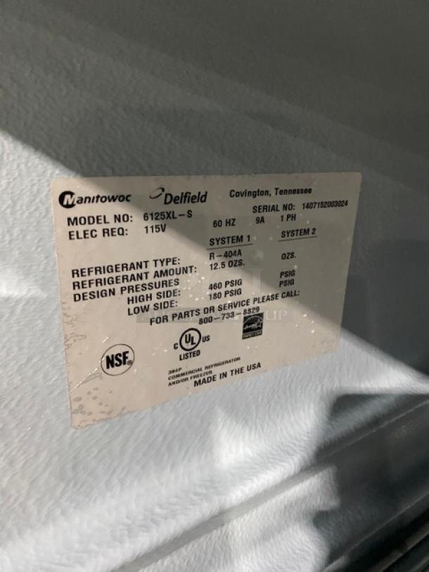 Delfield Spec Line 6125XL-S single door freezer, Energy Star certified, on casters, label shows model and serial number details.
