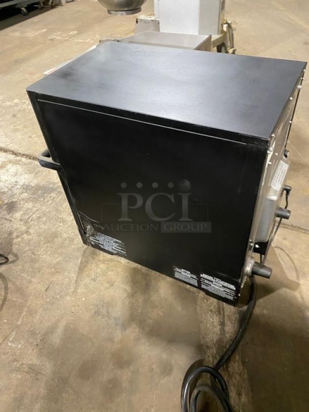 MerryChef Eikon E2S black electric rapid cook oven, countertop model, 208/240V, 1 phase, in good condition with visible side labels.