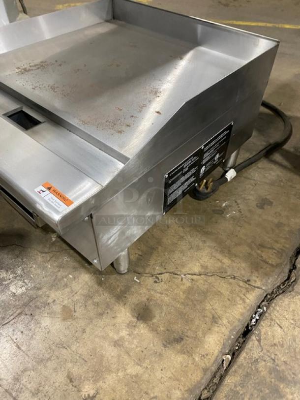 2023 Standard Range 24" stainless steel electric griddle, model SR-EG24, with scratches. Features backsplash, thermostatic controls, SN: SR2370971.