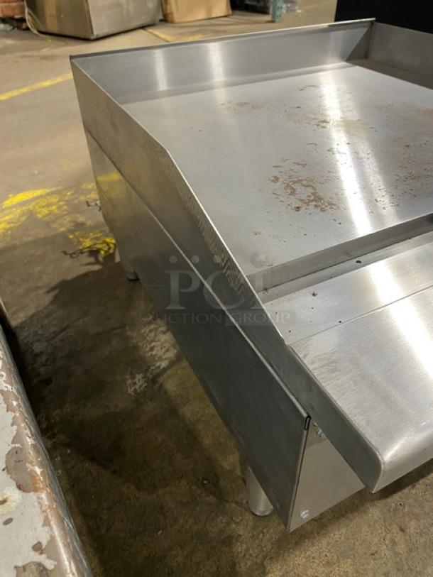 Commercial stainless steel electric 24" flat griddle, model SREG24, with thermostatic controls and back/side splash.