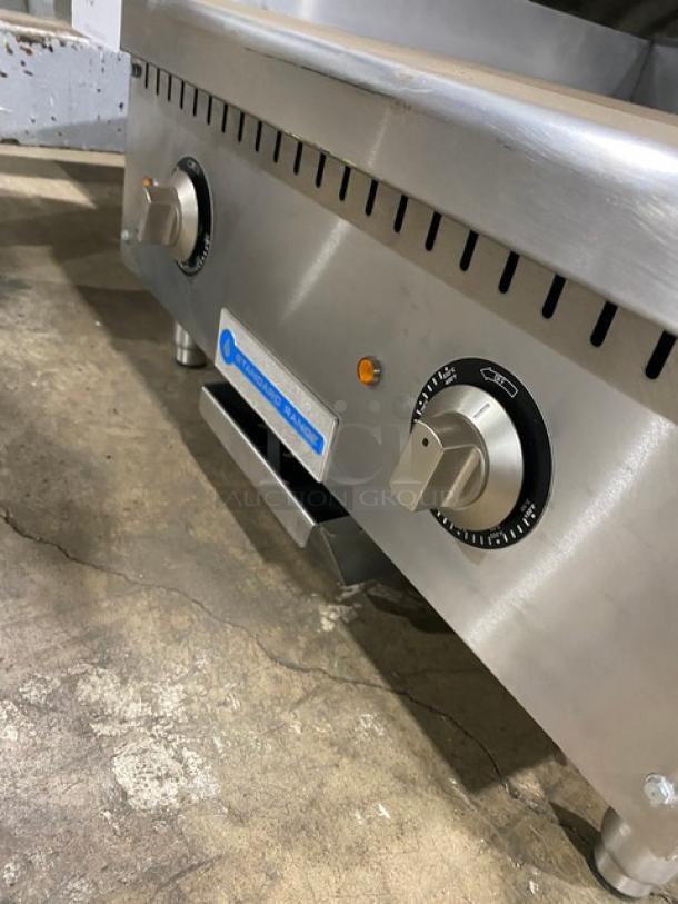 Standard Range SR-EG24 24" stainless steel electric griddle, thermostatic controls, scratch-n-dent, 208/240V, on legs.