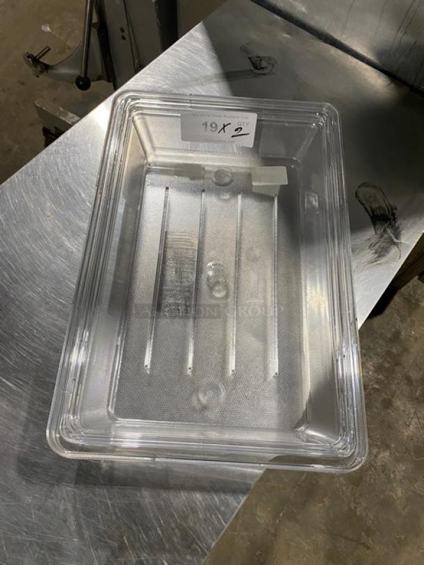 Rubbermaid Model 3307 clear polycarbonate 2-gal. rectangular food storage box, new condition, on a metal surface.