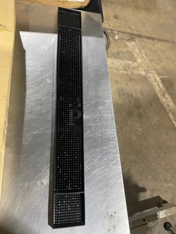 Brand new Update International BM27BK black rubber 27" bar mat, rectangular with textured surface for spill protection.