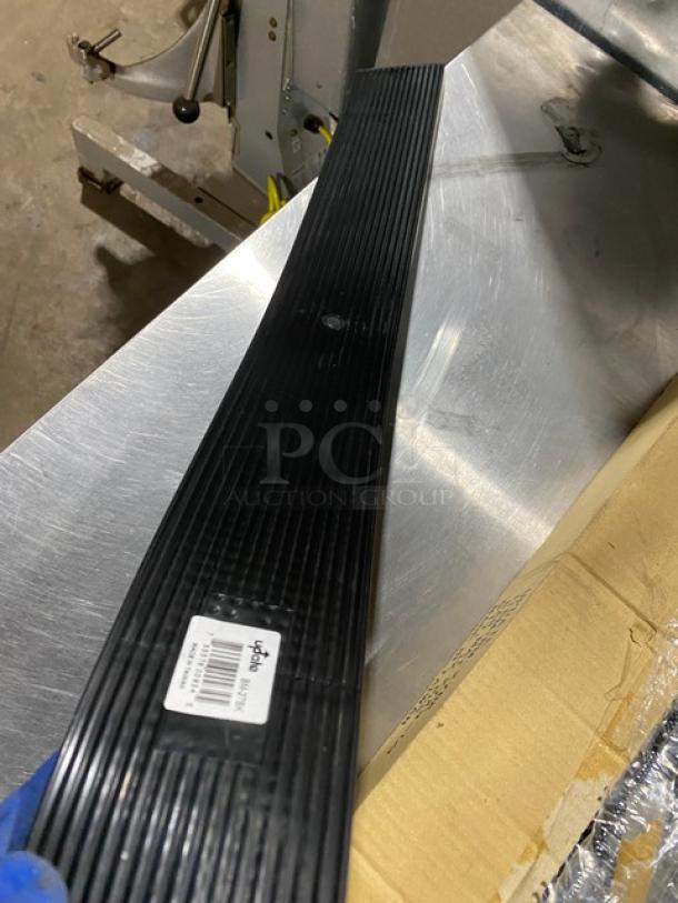 Brand new Update International BM27BK black rubber bar mat, 27" long, visible label. Ideal for commercial bar/service use.