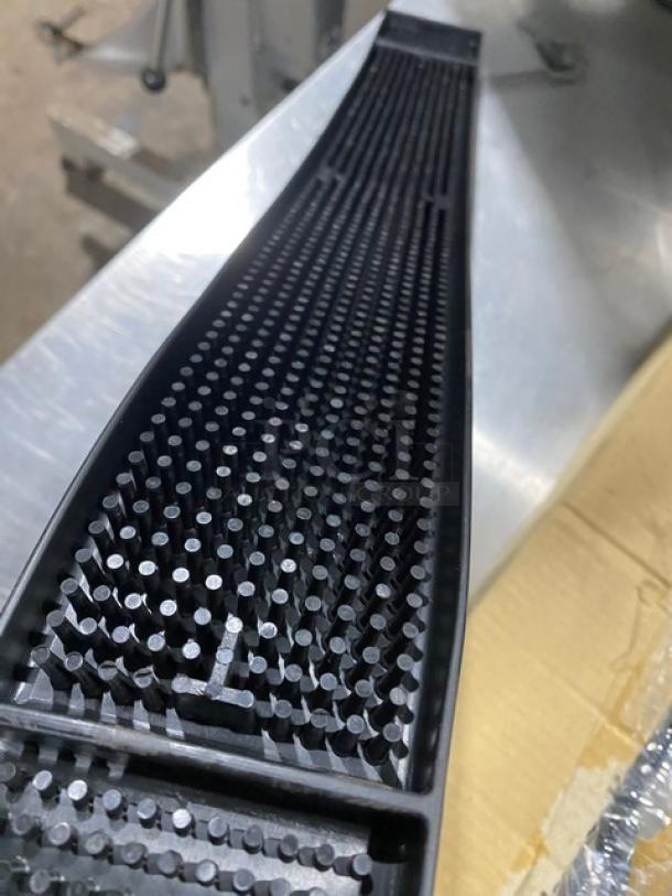 Brand new Update International black rubber bar mat, model BM-27BK, measures 27 inches, features raised grid for spill containment.