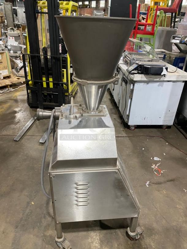 Commercial stainless steel electric sausage meat vacuum stuffer/filler on casters in good condition.