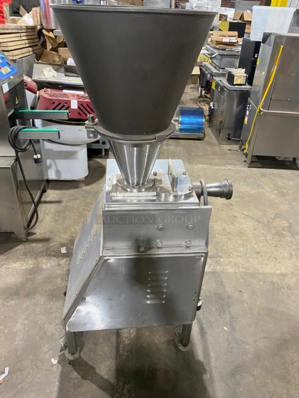 Commercial stainless steel electric sausage meat vacuum stuffer on casters. Features large funnel and durable design.