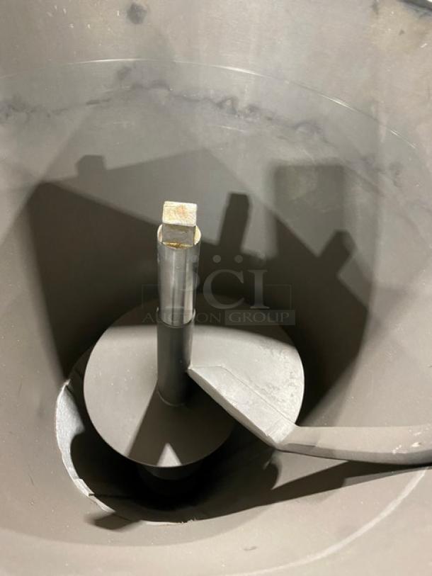 Commercial stainless steel electric sausage meat vacuum stuffer/filler, features durable construction, on casters for mobility.