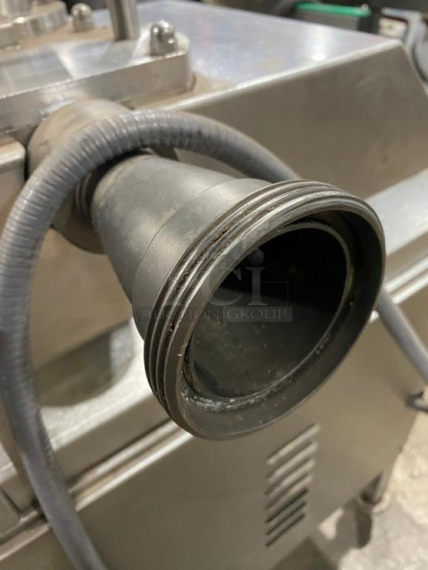 Commercial stainless steel electric sausage stuffer/filler, in good condition, features vacuum function, on casters.