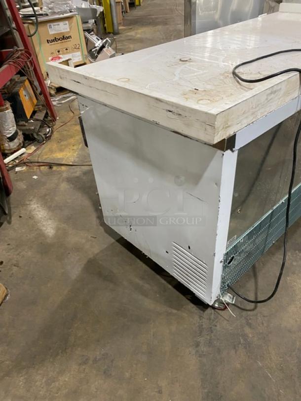 Leader ESLB72 white 3-door refrigerated lowboy cooler, 72", with back and side splash, poly coated racks, on casters, 115V 1Phase.