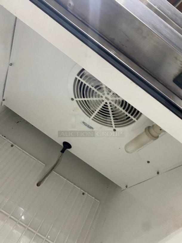 True T-23F stainless steel single-door freezer interior, featuring a poly-coated wire rack and Energy Star certification.