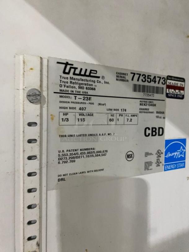 True T-23F stainless steel single door freezer, Energy Star, with poly coated wire rack. Model and SN tags visible.