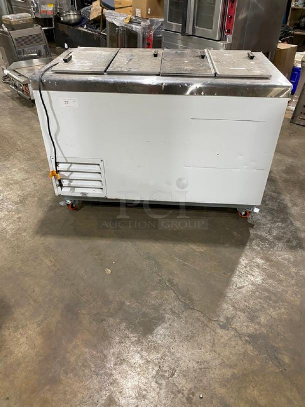 Excellence 54" commercial white ice cream cabinet, Model HFF8HC, with stainless steel top, flip lids, and casters, 115V.