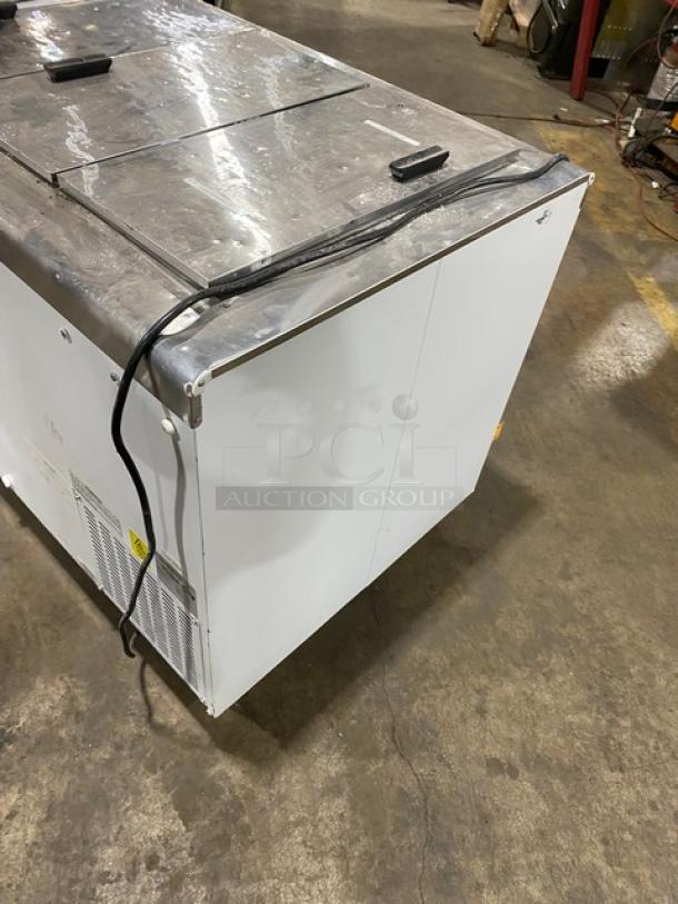 Excellence Commercial 54" ice cream dipping cabinet, model HFF8HC, white with stainless steel top and flip lids, on casters.