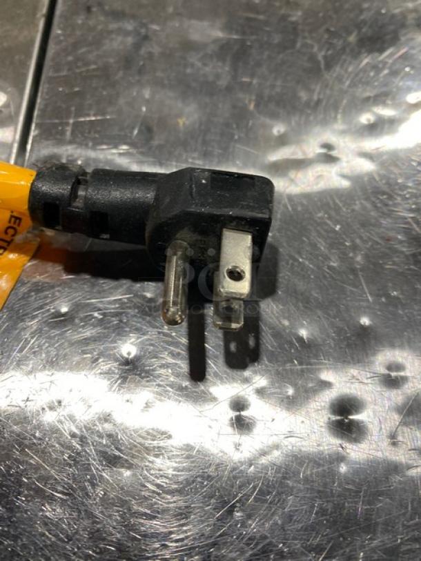 Close-up image of a power plug for the Excellence HFF-8HC ice cream cabinet.
