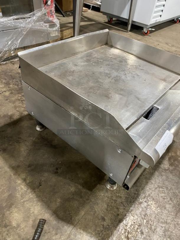 APW Wyott Champion Cook Series countertop flat griddle, stainless steel, natural gas, with back and side splash, on legs.