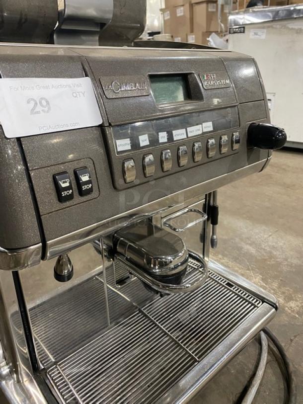 La Cimbali S39-Barsystem stainless steel automatic espresso machine with clear polycarbonate hopper, steam wand, drip tray, and legs.