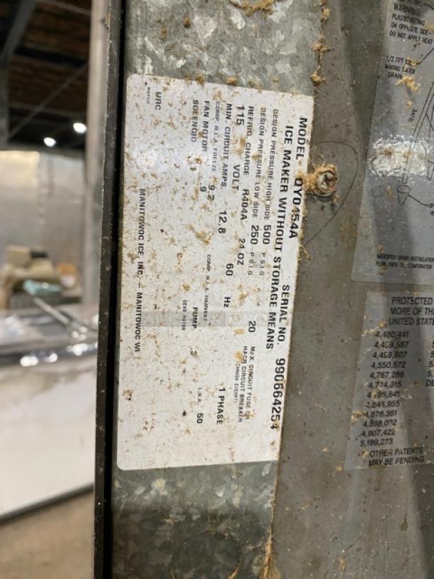 Manitowoc stainless steel ice maker, model QY0454A, electric, air-cooled, 115V 1-phase, on legs, working condition, visible label.