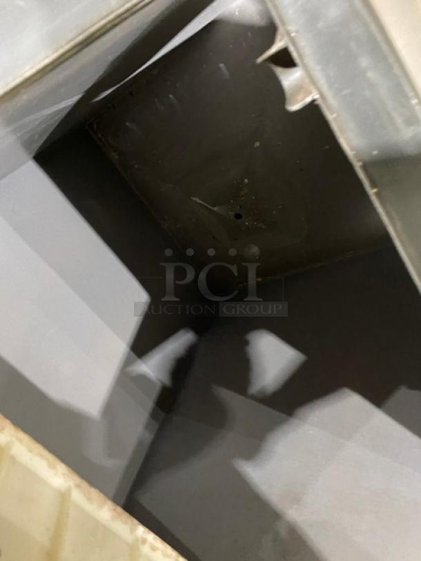 Manitowoc QY0454A ice machine interior, stainless steel, air-cooled, 115V, on legs. Working condition noted.