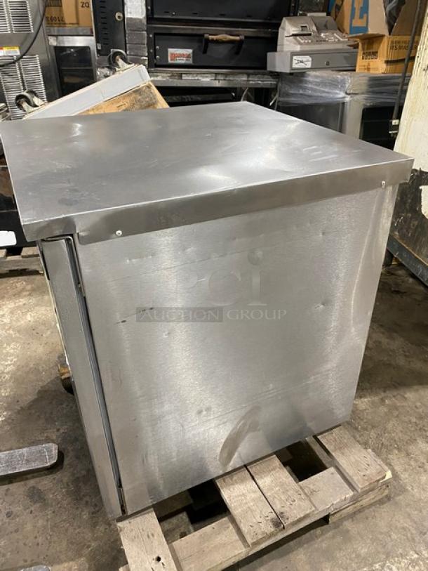 Delfield Enodis Series stainless steel single door undercounter refrigerator, model 406STAR2, on warehouse floor.