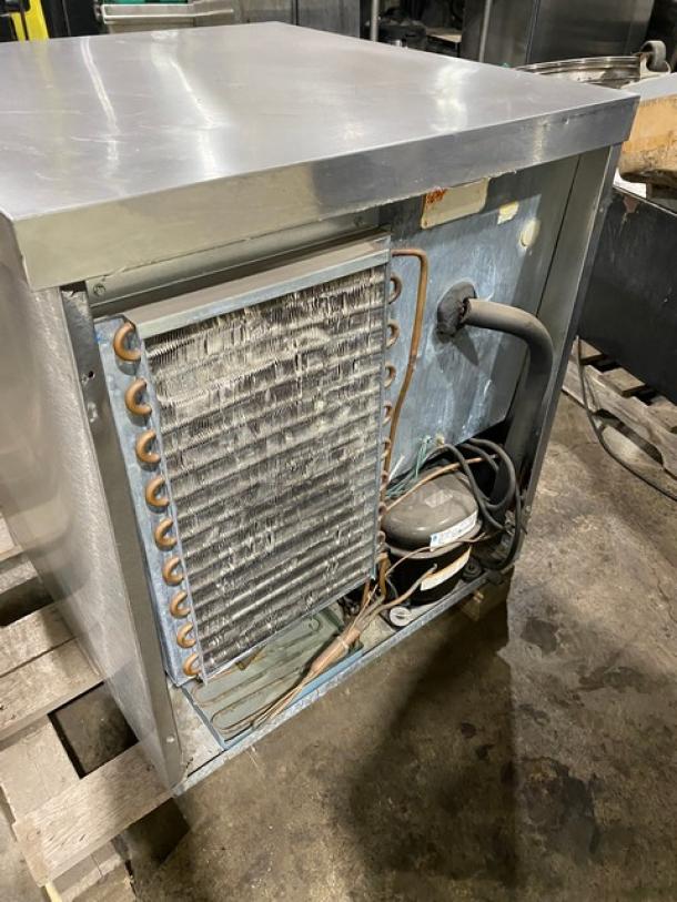 Delfield Enodis Series 406-STAR2 stainless steel undercounter refrigerator, single door, visible cooling coils, used condition.