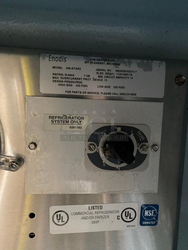 Delfield Enodis Series 406-STAR2 label with model, serial number, and electrical specs; commercial refrigerator details.