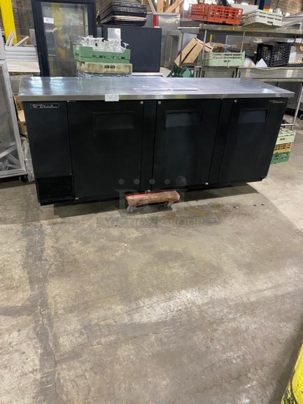 True commercial TDD-4 kegerator, black powder-coated, 3 doors, stainless steel worktop, drip tray, 90" wide, 115V.