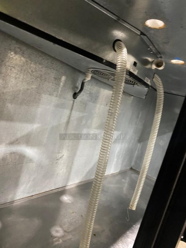 True TDD4 kegerator interior view showing dispensing lines and stainless steel surface. Model TDD4, SN: 7296168.
