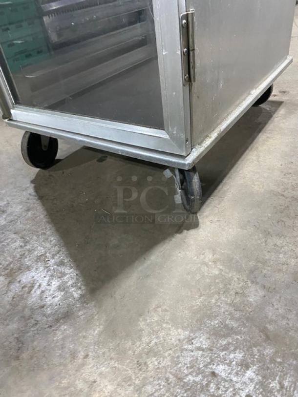 Lockwood CA72RR18SR stainless steel display/transport cabinet with clear half door, built-in pan slides, and casters.